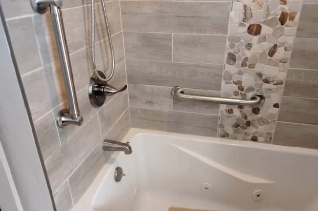 Grab_Bars_Shower-aspect-ratio-960-640 A shower/tub enclosure with grab bars installed.