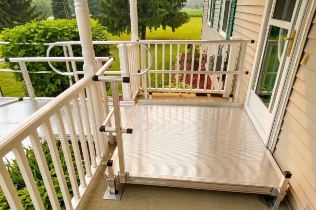 A wheelchair ramp installed at the front entrance of a home.