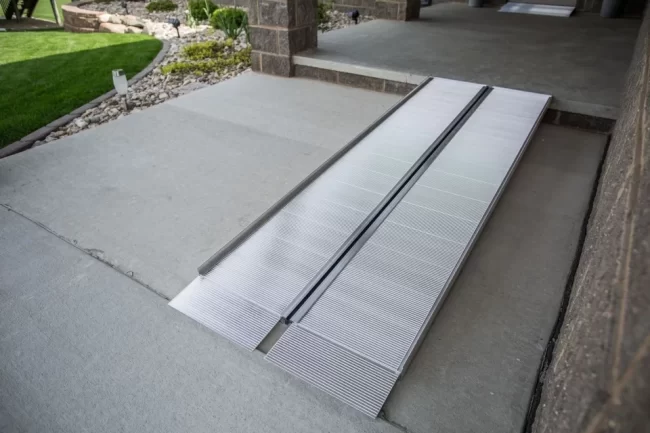 Picture of a wheelchair ramp rental installed at a brick building.